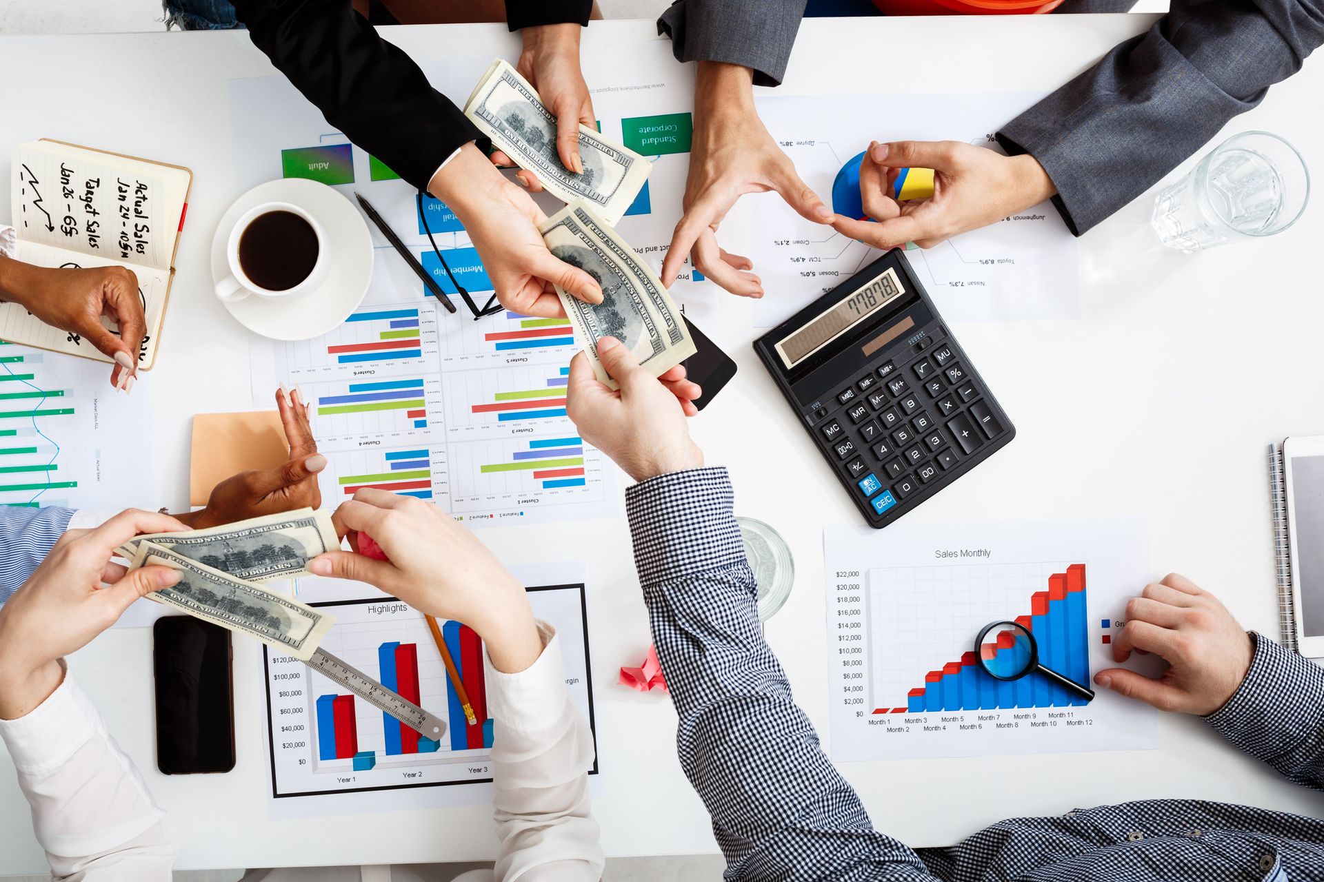 businessmen-hands-white-table-with-documents-drafts-min